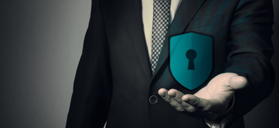 businessman holding a shield.
